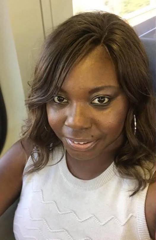 black woman in custom wig made from donated hair