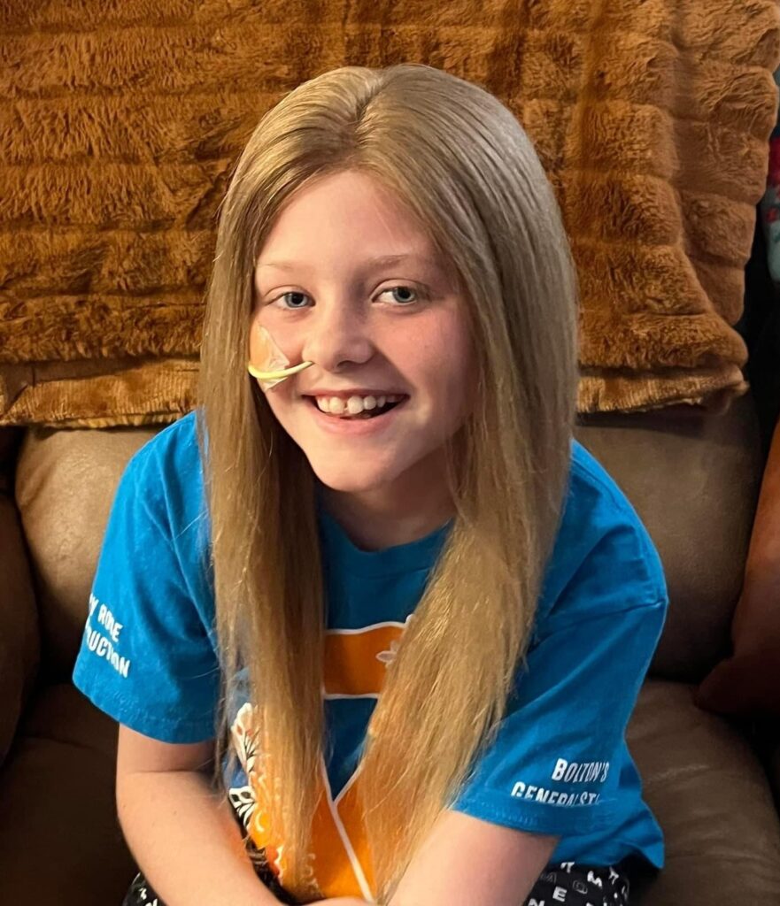 child in wig made from her own hair